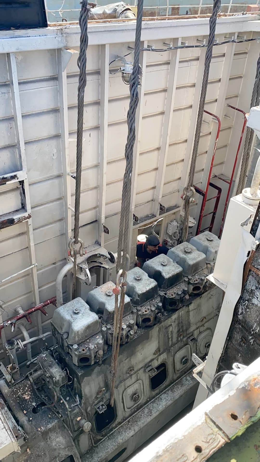 Main engine secured with lifting slings inside the engine room