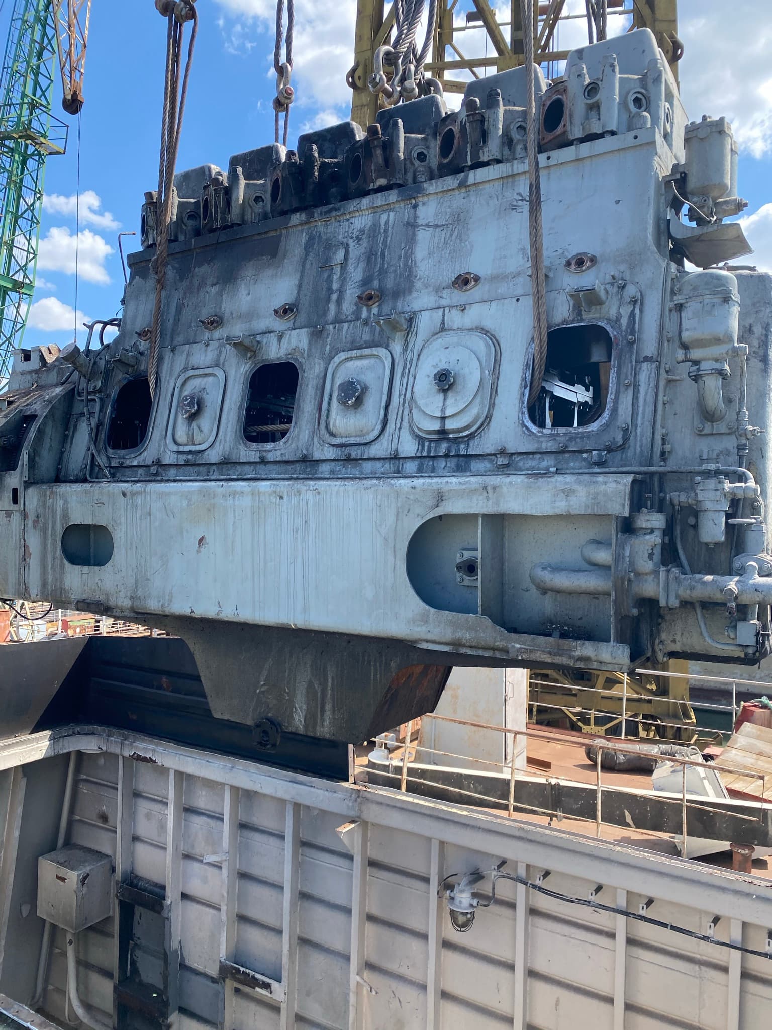 Main engine being lifted clear of the vessel's machinery space