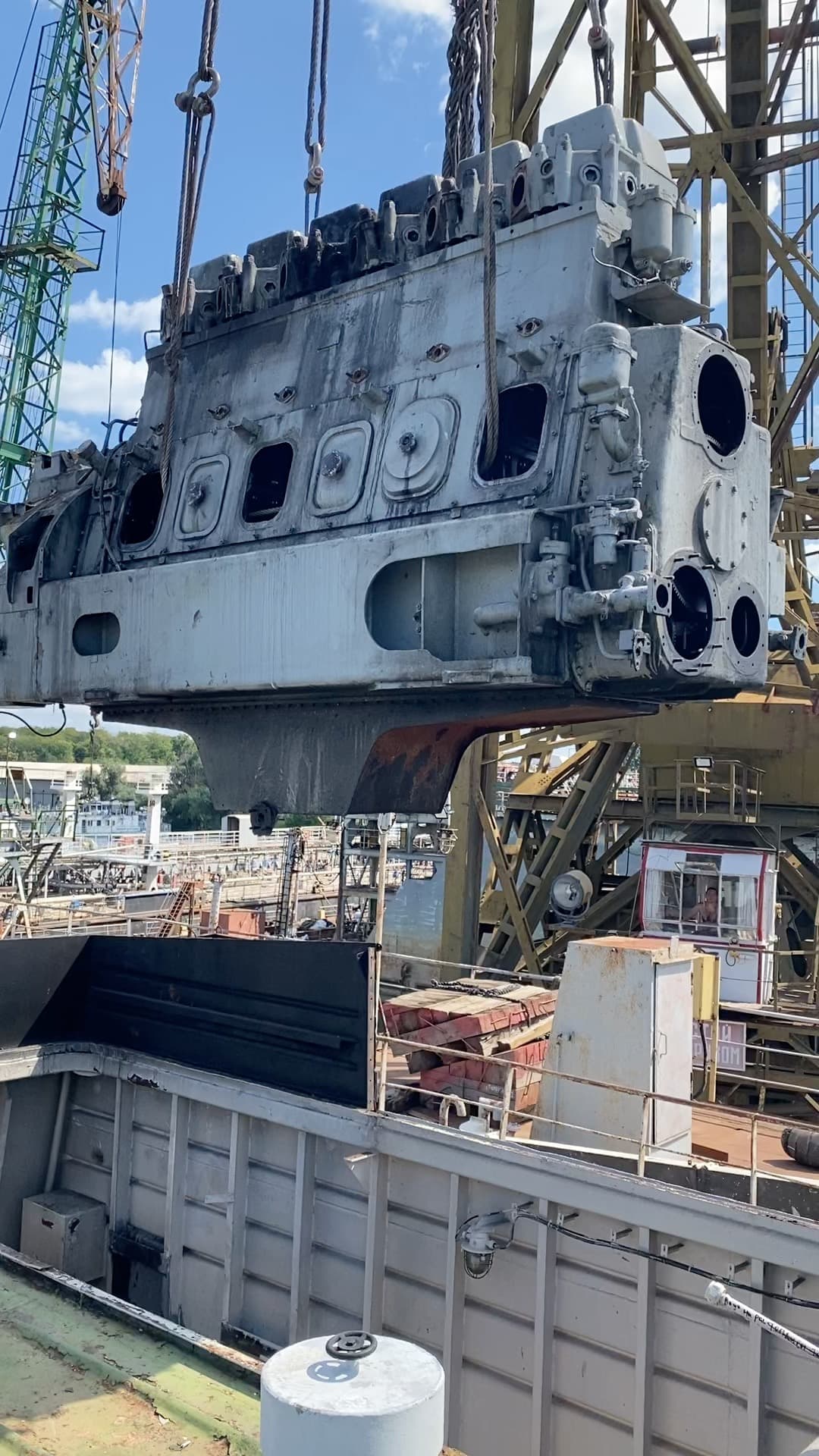 Main engine lifted above the deck of M/V Asket 2