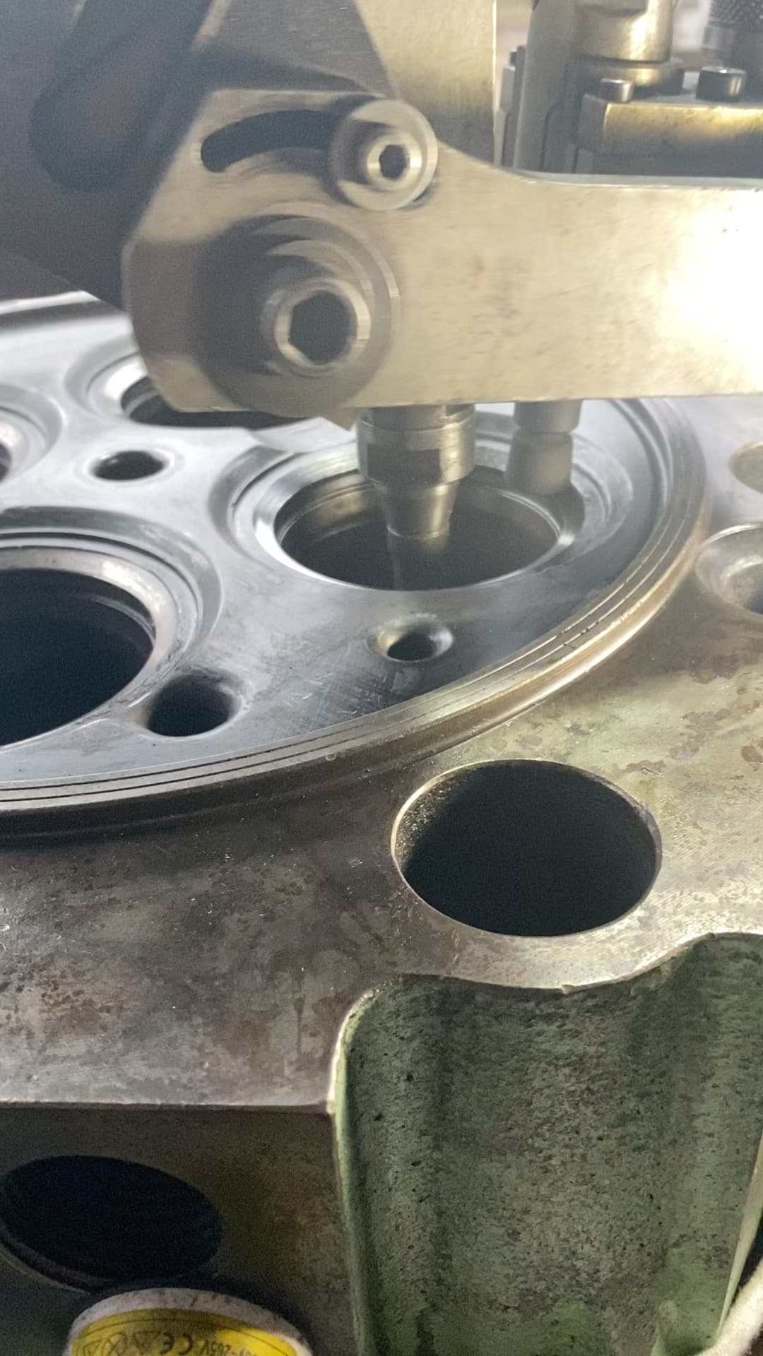 Precision machining of a valve seat in a marine engine cylinder head